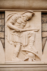 antique Beautiful bas-relief sculpture on wall ancient Greek style . bas-relief of ancient Greek warrior