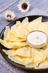 Dumplings, filled with cottage cheese (farmer cheese). Varenyky, vareniki, pierogi, pyrohy. vertical