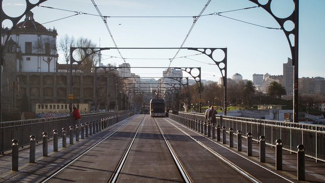 Walking at Dom Luis I Bridge in Porto, Portugal in the sunny moning