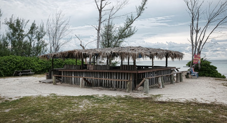 Old Weathered Tiki Bar on a Beach