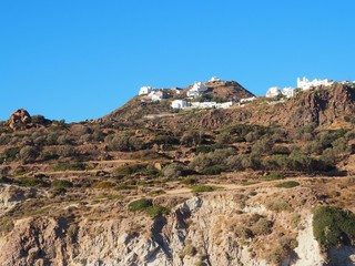small town on a hill with blue sky