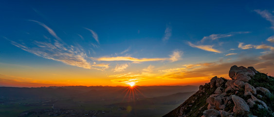 Sun rays at Sunset on Horizon