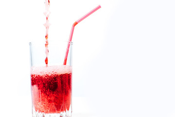 different fruit and juice or smoothie in a glass