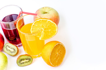 different fruit and juice or smoothie in a glass