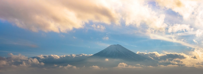 Mountain Fuji in sea of mist or fog at sunrise with cloudy sky, Fujikawaguchiko, Yamanashi, Japan.