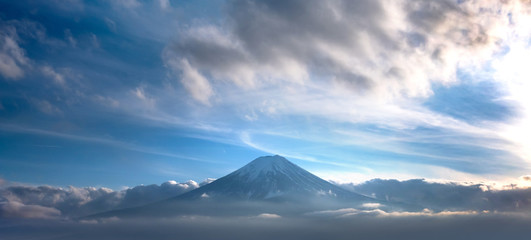 Mountain Fuji in sea of mist or fog at sunrise with cloudy sky, Fujikawaguchiko, Yamanashi, Japan.