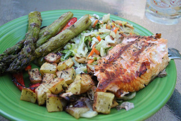 grilled vegetables salmon steak fillet on plate closeup asparagus