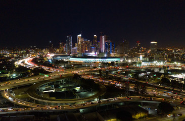 Fototapeta na wymiar Urban aerial view of the downtown Los Angeles convention center, city skyline and freeway traffic at night