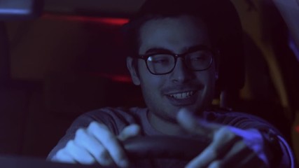 Car driver at night being pulled over by a police car