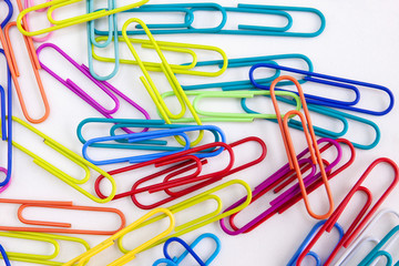 Colorful paper clips decorative on white desktop background, Abstract, Office supply concept.