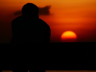 Fototapeta premium The man take the sunset photo at Bangpu Recreation Center ,Samut Prakan THAILAND.