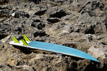 surfboard lies on the reef