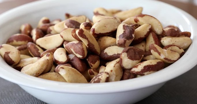 Brazil nuts pouring in a bowl 3