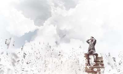 Young man in day sky dont want to hear anything