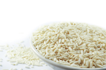 rice in cup on white background / raw white Jasmine rice dry for food