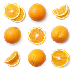 A set of whole and sliced oranges, cut out. Top view.