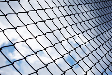 Looking for freedom, view look up to the sky imprisoned by cage