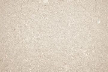 Art concrete or stone texture for background in black, brown and cream colors. Cement and sand wall of tone vintage.