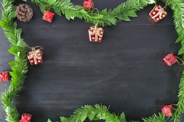 Xmas Copy space, Christmas composition decorations on black wood background Flat lay, top view.