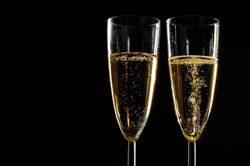 Champagne glasses for festive occasion against a dark background