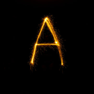 Alphabet Sparklers On Black Background Single Letter