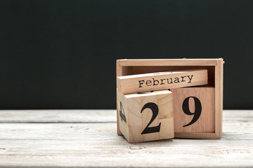 February 29th. Day 29 of february month, calendar on wooden background. Winter time - obrazy, fototapety, plakaty