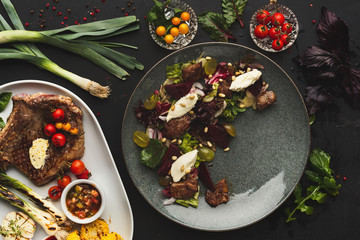 Main course and salad served at restaurant