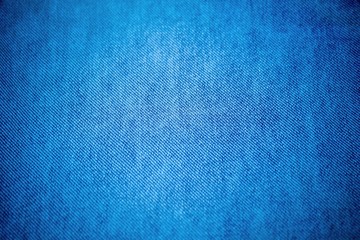 Fototapeta na wymiar old pale blue denim jean texture - closeup