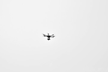 silhouette drone on pale white background