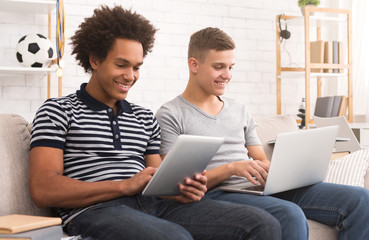 Young guys studying for exams at home