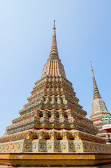 Fototapeta premium Bangkok, Thailand Wat Pho Temple Of The Reclining Buddha. The Great Pagodas of the Four Kings. This is a group of 4 huge pagodas (stupas) in honor of the first 4 monarchs of the Chakri dynasty. 