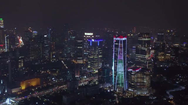 JAKARTA, Indonesia - December 17, 2018: Beautiful aerial view of night time in Jakarta financial center with skyscrapers view and night lights. Shot in 4k resolution
