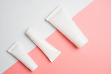 flat lay with cosmetic products tubes branding