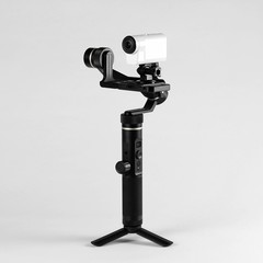 White action camera on three-axis stabilizer. Close up. Isolated on grey background