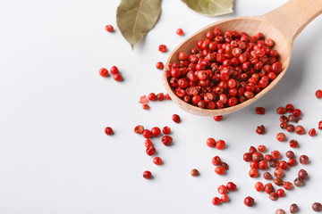 Red peppercorn aroma condiment in wooden spoon