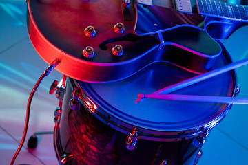Guitar lies on the drum