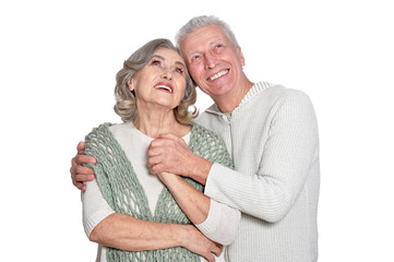 Happy senior couple posing isolated on white background