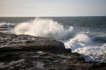 waves crashing on rocks