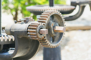 Close up ,rusty cogwheel metal mechanical gear on the floodgate background