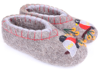 Sheep wool bast shoes on white background.