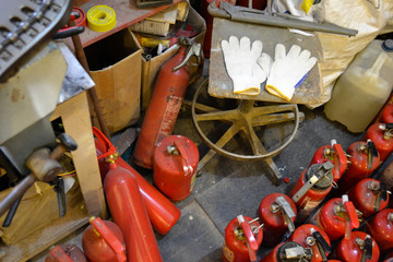 workshop with various fire extinguishers, large gas cylinders