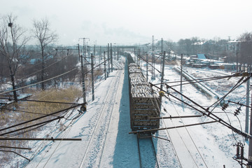 rail cars loaded with the wood being transported from nearby mines to power plants in winter