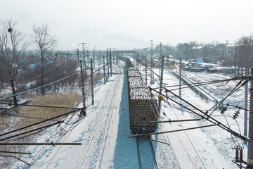 rail cars loaded with the wood being transported from nearby mines to power plants in winter