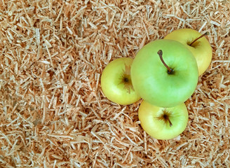 White apples on the background of sawdust