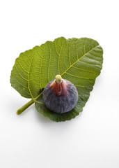 Fig fruits with leaves on white