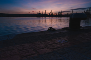 Autumn sunset at the sea station with ships.