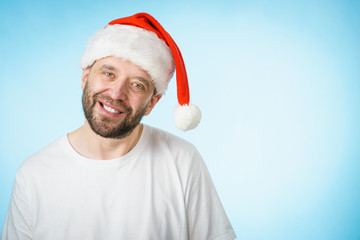 Smiling man in santa claus hat portrait