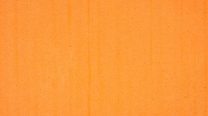 Fototapeta premium Close up of an orange sponge for a background.
