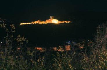 The Trapezitsa fortress, illuminated at night.