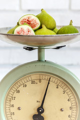 Antique kitchen scale and ripe figs